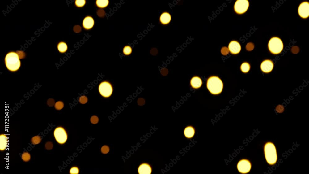 Wall mural beautiful loop animation yellow orange bokeh particles fallig dwon on black abstract background.