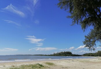 Bagan Lalang beach Selangor Malaysia ,beautiful beach suitable for camping ,swimming and picnic. Cloudy and blue sky background