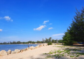 Cherating beach pahang , Malaysia. Beautiful beach suitable for camping ,swimming and picnic. Cloudy and blue sky background 