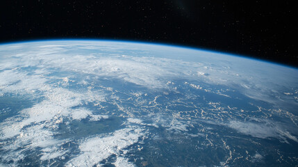 Earth from space, showing clouds, atmosphere, and curvature.