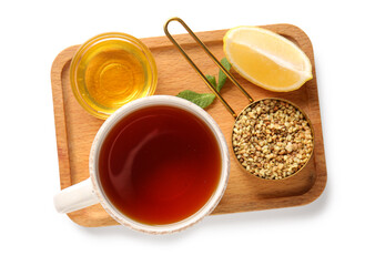 Cup of hot buckwheat tea with lemon and glass bowl of honey on white background
