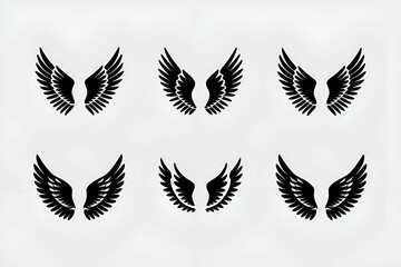 Obraz premium artistic arrangement of black wing silhouettes symbolizing freedom, spirituality, and inspiration, ideal for creative, spiritual, or symbolic designs. 