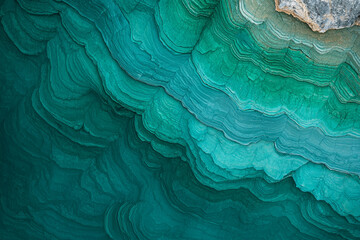 Abstract teal layered rock formation texture.