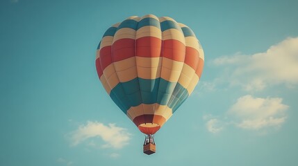 Naklejka premium Colorful hot air balloon soaring in a clear blue sky.