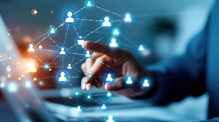 A hand points at a digital interface depicting connections between users, highlighting networking and technology in a modern workspace.