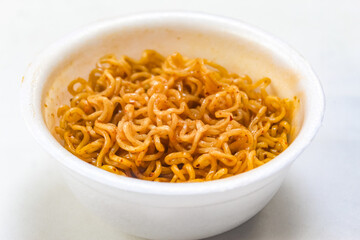 noodles in a bowl on a white background