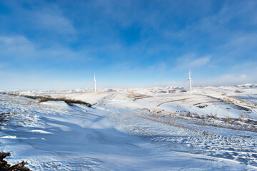 Fototapeta premium Winter grassland sky road scenery in Zhangjiakou, Hebei Province, China