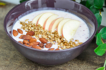 smoothie bowl , strawberry smoothie or strawberry yogurt with apple , sunflower seed and almond