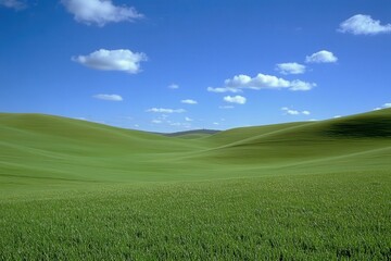 Obraz premium Rolling green hills under a bright blue sky with fluffy white clouds. Perfect for illustrating nature, serenity, or agricultural themes.