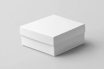 Fototapeta premium Simple white square box on grey background. Perfect for packaging, product, or design mockups.