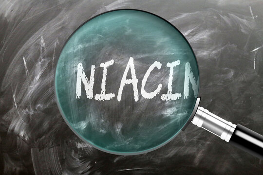 Niacin - learn, study and inspect it. Taking a closer look at niacin. A magnifying glass enlarging word 'niacin' written on a blackboard ,3d illustration
