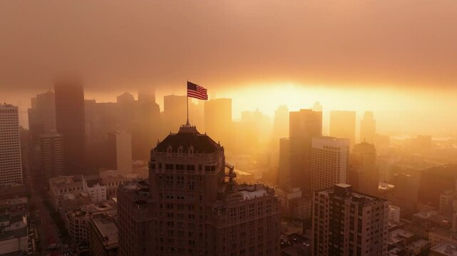 Aerial Drone Shot of American Flag Waving at Sunrise Over San Francisco Skyline and Nob Hill, California