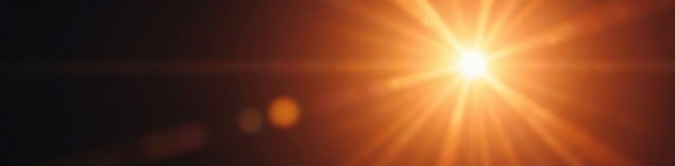 Fototapeta premium A shining ray emanates from a lens flare in the sun, glowing light, glow, photography