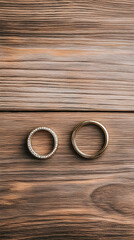 Wedding rings on wooden background, romantic symbol, marriage, love, commitment, anniversary,  for wedding invitations or blogs.