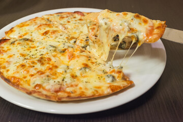 A slice of pizza with cheese on it
