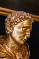 Golden Baroque-style bust sculpture of Apollo, showcasing exquisite craftsmanship, mythological beauty, and timeless artistic elegance