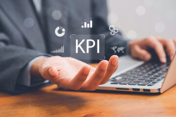 KPI, business performance indicators, Businessman working with data management system on virtual screen to make report with KPI, metrics connected to database. finance, operations, sales, marketing.