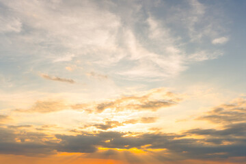 Beautiful morning or evening orange or yellow and blue sky with cloudy when sunset or sunrise used as natural background texture in decorative art work
