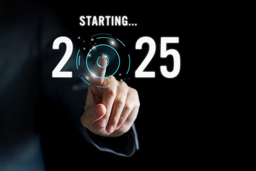 Happy new year 2025, Businessman pressing the start button for 2025 on virtual screen. Concept of planning, start, career path, business strategy, opportunity and change.