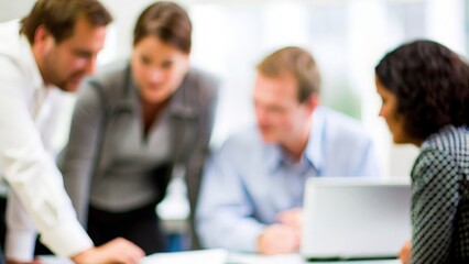 A soft blur of a group of professionals brainstorming around a table.

