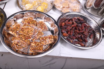 hindu wedding culture and tradition -varisai thatu a collection of plates containing various fruits, sweets and wedding items