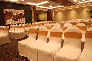 chairs arranged in a hall meant for weddings and events