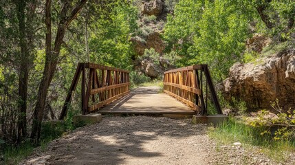 Scenic view of rustic double bridge on Navaho Loop Trail surrounded by lush greenery and rocky terrain in a serene natural landscape