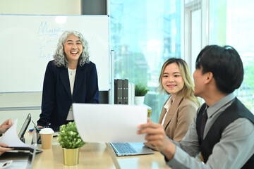 Group of professionals businesspeople collaborating on a marketing strategy in a modern office