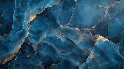 A close-up of the surface texture of blue marble with dark veins and a deep oceanic color palette. The blurred background with turquoise tones highlights the intricate patterns on the stone.