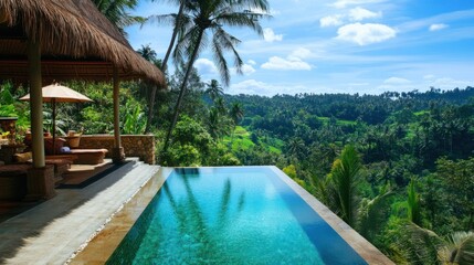 A breathtaking view from a villa terrace with a sparkling infinity pool overlooking lush green hills and palm trees
