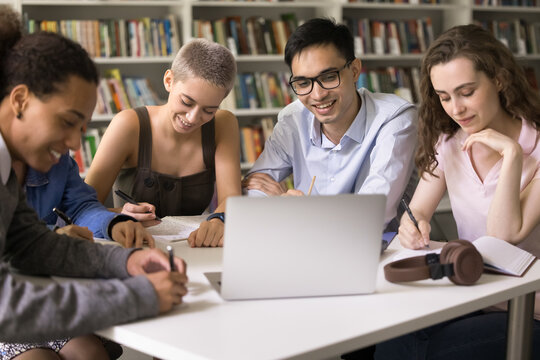 Remote class. Diligent group of multicultural international high school students study on distance take notes of virtual lecture lesson listen to teacher professor online in conference app on notebook