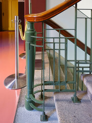 Railings on rooftops or staircases that prevent falls and assist movement. Functional and safety-oriented design.