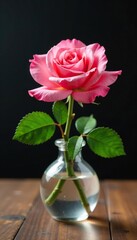 Fototapeta premium Single pink rose blooms in a small glass vase on a wooden table, stem, flower
