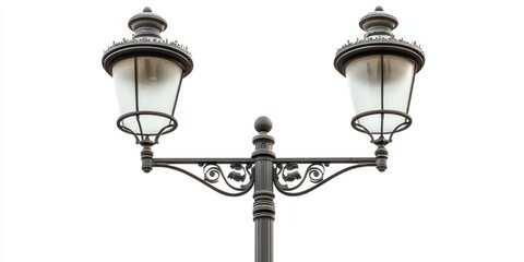 A tall, double-headed street lamp with curved metal arms and frosted glass shades, centered on a...