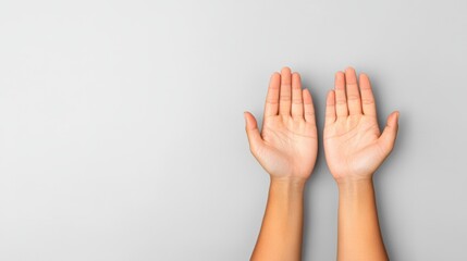 Hands Reaching Up in Gesture of Hope and Positivity Against Light Gray Background for Creative Use