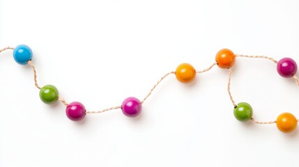 Abstract network connection concept with colorful string and wooden beads on white background, representing digital communication and interconnectedness


