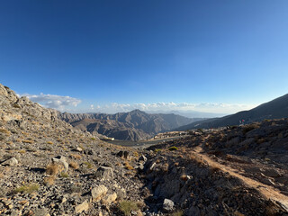 Jebel Jais, the UAE's tallest mountain, offers stunning views, with cooler UAE temperatures. A haven for adventurers, it combines rugged beauty with serene sunsets.