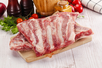 Raw pork ribs over board