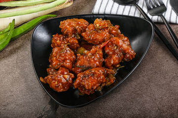 Manchurian chicken with sauce and spices