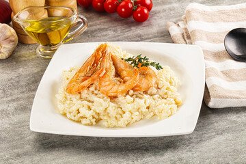 Italian risotto with prawn served thyme
