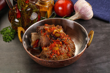 Baked beef ribs with vegetables