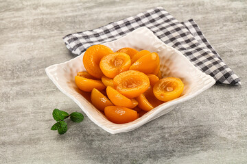 Sweet canned apricots with syrope