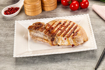 Grilled pork loin steak with bone