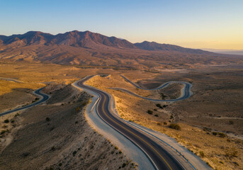 Fototapeta premium Winding Desert Road at Sunset