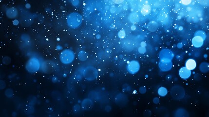 Fototapeta premium Abstract blue bokeh lights, glowing particles on dark background.
