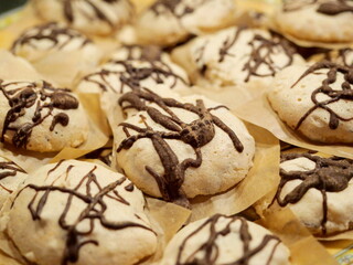 Delicate meringue cookies with chocolate glaze, homemade and popular. Full-frame shot, perfect for food photography and creative design ideas