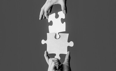 Man hands connecting couple puzzle piece. Business solutions, target, success, goals and strategy...