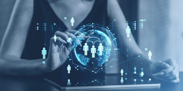 Digital icons of people with a holographic globe, symbolizing social media connections and networking on a modern interface.