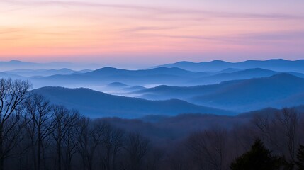 Obraz premium 4. Layered mountain ridges fading into the mist under a pastel-colored morning sky