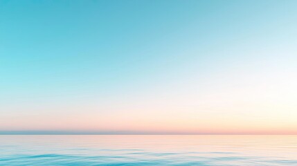 Minimal skies concept. Serene ocean view at sunset, blending soft colors of blue and pink in the horizon.
